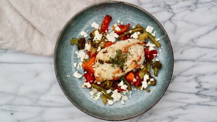 Fried Sheepshead fish on a green and red salad with Feta&nbsp;cheese