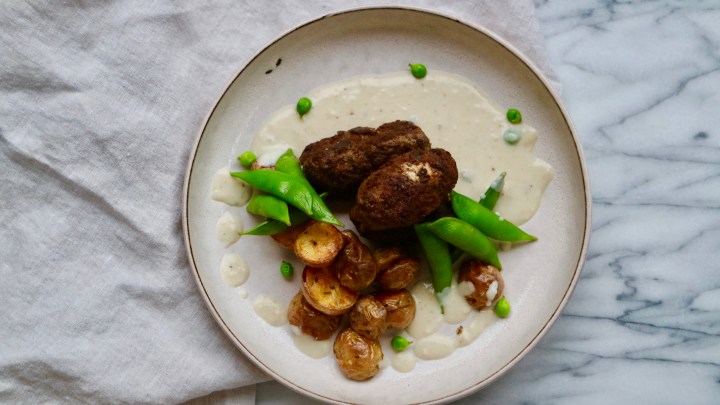 Filled Beef Croquette with grilled potatoes, sugar snap peas and a creamy&nbsp;sauce